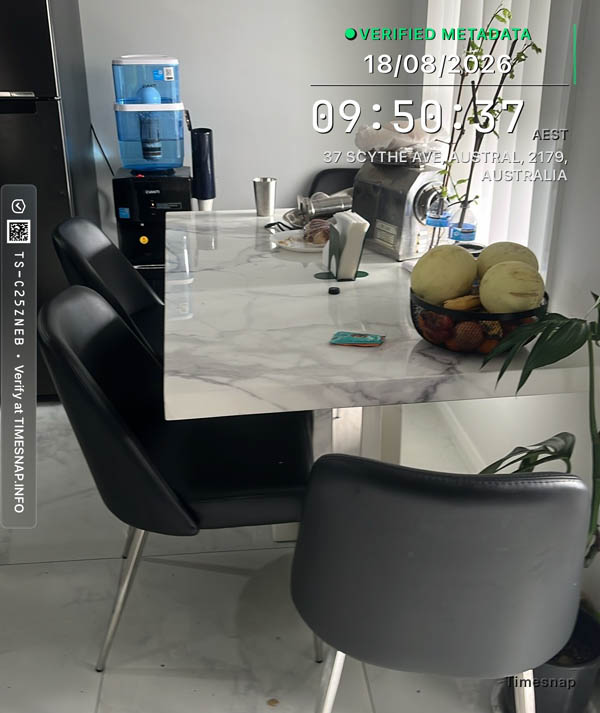 Dining table cluttered before cleaning, Austral
