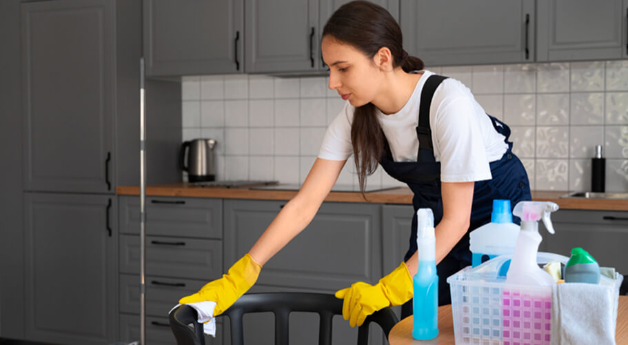 Professional cleaner working in a Sydney home kitchen